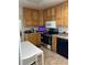 Charming kitchen featuring oak cabinets, a black dishwasher, and stainless steel appliances at 2201 S Peninsula Dr, Daytona Beach, FL 32118