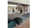 Large, open-concept living room with ample space, carpet flooring, and built-in shelving at 2201 S Peninsula Dr, Daytona Beach, FL 32118