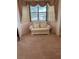 Cozy sitting area features a comfortable chair, natural light, and neutral tones at 2201 S Peninsula Dr, Daytona Beach, FL 32118