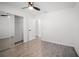Bedroom with wood floors and large mirrored closet at 24 Sea Gull Dr, Ormond Beach, FL 32176