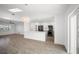 Spacious living room with modern lighting, vaulted ceilings, and an open layout to the kitchen, creating an inviting atmosphere at 24 Sea Gull Dr, Ormond Beach, FL 32176