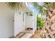 Private outdoor shower with white enclosure and walkway at 24 Sea Gull Dr, Ormond Beach, FL 32176