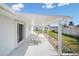Covered patio with seating area, perfect for outdoor relaxation and enjoying the backyard view at 24 Sea Gull Dr, Ormond Beach, FL 32176