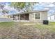 Spacious backyard with screened porch and partially fenced yard at 242 W Fiesta Key Loop, Deland, FL 32720