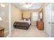 Simple bedroom with double bed and wooden dresser at 242 W Fiesta Key Loop, Deland, FL 32720