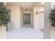 Inviting front porch with green chairs and a charming entryway at 242 W Fiesta Key Loop, Deland, FL 32720