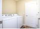 Laundry room with washer, dryer, and extra storage at 242 W Fiesta Key Loop, Deland, FL 32720