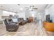 Spacious living room with hardwood floors and comfy leather recliners at 242 W Fiesta Key Loop, Deland, FL 32720