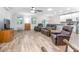 Open living room featuring hardwood floors and a view into the kitchen at 242 W Fiesta Key Loop, Deland, FL 32720