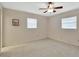 Comfortable bedroom with neutral walls, carpet, and natural light streaming through the windows at 244 Oakleigh Dr # 200, Deland, FL 32724