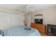 Bedroom with wood-look floors, large closet, and nice dresser at 2610 Hialeah Ave, The Villages, FL 32162