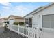 Front view of single story home with white picket fence at 2610 Hialeah Ave, The Villages, FL 32162