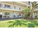 Lush green lawn and patio area offering a relaxing outdoor space with multiple seating options at 2711 N Halifax Ave # 184, Daytona Beach, FL 32118
