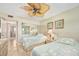 Bright bedroom featuring two twin beds, mirrored closet, and tile floors at 2711 N Halifax Ave # 184, Daytona Beach, FL 32118