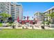 Community grilling area with multiple grills, picnic tables, and lush landscaping at 2711 N Halifax Ave # 184, Daytona Beach, FL 32118