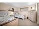 Cozy guest bedroom with twin beds, coordinating decor, and a bright window at 2711 N Halifax Ave # 463, Daytona Beach, FL 32118