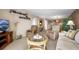 Open living room showcasing comfortable seating, neutral color scheme, and access to other rooms at 2711 N Halifax Ave # 463, Daytona Beach, FL 32118