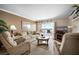 Comfortable living room with sliding glass doors leading to a balcony and scenic views at 2711 N Halifax Ave # 463, Daytona Beach, FL 32118