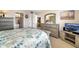 Spacious main bedroom featuring neutral decor, furniture, and access to the ensuite bathroom at 2711 N Halifax Ave # 463, Daytona Beach, FL 32118