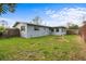 Fenced backyard with a nice lawn at 303 Warwick Ave, Ormond Beach, FL 32174