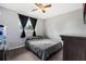 Cozy bedroom with a window, ceiling fan, and a small closet at 303 Warwick Ave, Ormond Beach, FL 32174