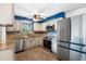 Modern kitchen with stainless steel appliances, granite countertops, and stylish backsplash at 303 Warwick Ave, Ormond Beach, FL 32174