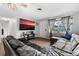 Relaxing living room showcasing a comfortable sectional, modern decor, and ample natural light at 303 Warwick Ave, Ormond Beach, FL 32174
