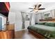 Comfortable bedroom with two windows, ceiling fan, and a spacious closet at 303 Warwick Ave, Ormond Beach, FL 32174