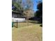 Backyard view showing a fenced area and grassy lawn at 309 N Boston Ave, Deland, FL 32724