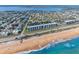 Stunning aerial view of beachfront condo near ocean, Intracoastal Waterway, and homes in Palm Coast, Florida at 3180 Ocean Shore Blvd # 309, Ormond Beach, FL 32176