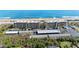 An aerial view of the property's buildings, parking, and the nearby ocean at 3180 Ocean Shore Blvd # 309, Ormond Beach, FL 32176