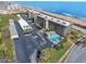 An oceanfront condo building featuring a community pool and ample parking for residents at 3180 Ocean Shore Blvd # 309, Ormond Beach, FL 32176