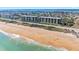 Stunning aerial view of beachfront condos, ocean views, and access to pristine sandy beaches at 3180 Ocean Shore Blvd # 309, Ormond Beach, FL 32176