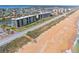 Expansive aerial view of beachfront condo with pool, walking access to beach in Palm Coast, Florida at 3180 Ocean Shore Blvd # 309, Ormond Beach, FL 32176