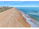 Scenic aerial view of sandy beach and beautiful ocean, near beachfront condos in Palm Coast, Florida at 3180 Ocean Shore Blvd # 309, Ormond Beach, FL 32176