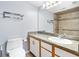 Bathroom featuring a walk-in shower with stylish tile, safety bars, and updated vanity at 3180 Ocean Shore Blvd # 309, Ormond Beach, FL 32176