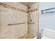 Bathroom featuring a walk-in shower with stylish tile, safety bars, and updated vanity at 3180 Ocean Shore Blvd # 309, Ormond Beach, FL 32176