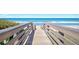 Enjoy the ocean view from this wooden boardwalk to the beach at 3180 Ocean Shore Blvd # 309, Ormond Beach, FL 32176