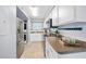 Beautiful kitchen featuring modern appliances, white cabinets, and ample countertop space, perfect for cooking and entertaining at 3180 Ocean Shore Blvd # 309, Ormond Beach, FL 32176