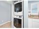 In-unit stacked washer and dryer, enhancing the convenience of this home at 3180 Ocean Shore Blvd # 309, Ormond Beach, FL 32176