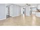 Spacious living area showcasing ceramic floors and a view into the kitchen and other rooms at 3180 Ocean Shore Blvd # 309, Ormond Beach, FL 32176