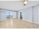 Open-concept living room with sliding glass doors and tile flooring at 3180 Ocean Shore Blvd # 309, Ormond Beach, FL 32176