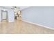 Bright and airy living room next to kitchen featuring tiled floors and plenty of space for entertaining at 3180 Ocean Shore Blvd # 309, Ormond Beach, FL 32176