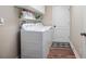 Laundry room featuring a washer and dryer, and shelves for storage at 35909 Joewood Ave, Leesburg, FL 34788