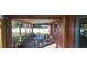 Covered screened patio with outdoor dining area at 35909 Joewood Ave, Leesburg, FL 34788