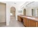 Bathroom features double sinks, spacious vanity, and archway to bedroom at 3633 Sickle St, Orlando, FL 32812