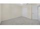 Bedroom offers neutral carpet, double door closet, ceiling fan, and ample natural light at 3633 Sickle St, Orlando, FL 32812