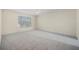 Large bedroom with plush carpeting, a ceiling fan, and a bright window, perfect for relaxation and comfort at 3633 Sickle St, Orlando, FL 32812