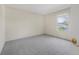 Bright bedroom featuring neutral paint, carpeted floors, and a window for natural light at 3633 Sickle St, Orlando, FL 32812