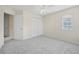 Bedroom with carpet floor, ceiling fan, closet, and large window at 3633 Sickle St, Orlando, FL 32812